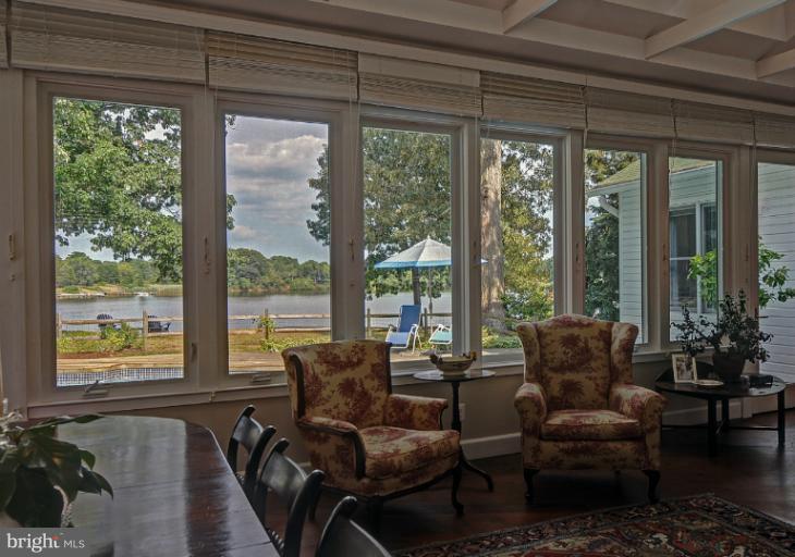 1775 Beachfield Road Annapolis, MD 21409 - Photo 14 of 25 a living room with furniture and floor to ceiling windows