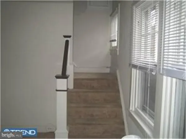 a view of staircase with a rug