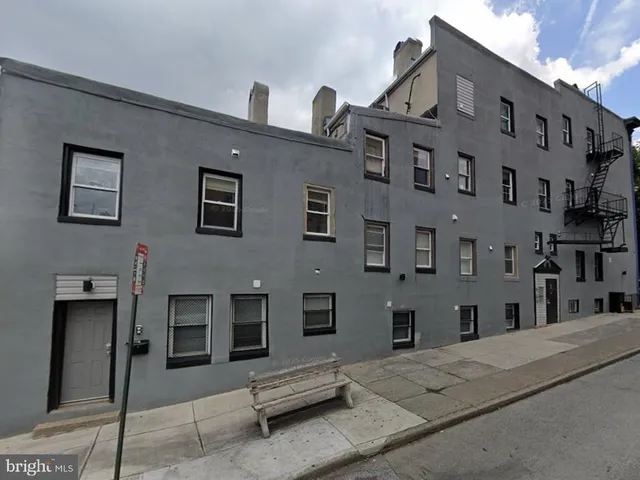 a front view of a building with windows