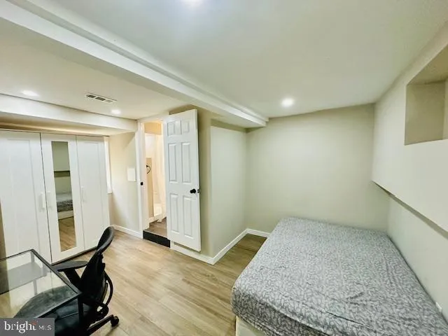 a large kitchen with cabinets and stainless steel appliances