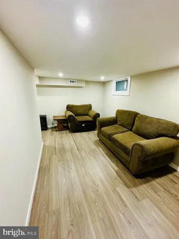 a view of hallway with wooden floor and staircase