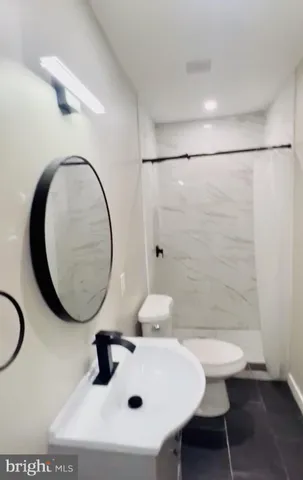 a spacious bedroom with a bed and a table in it