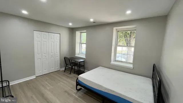 a kitchen with stainless steel appliances granite countertop white cabinets and a stove top oven