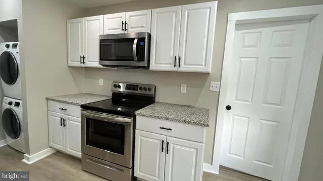 a view of a room with window wooden floor and a ceiling fan