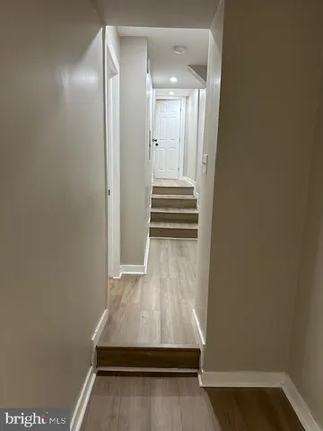 a kitchen with granite countertop a sink appliances and cabinets