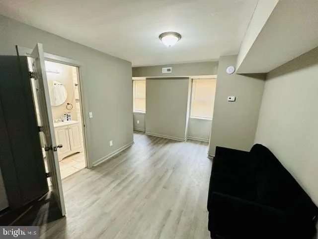 a bathroom with a sink a toilet and a shower