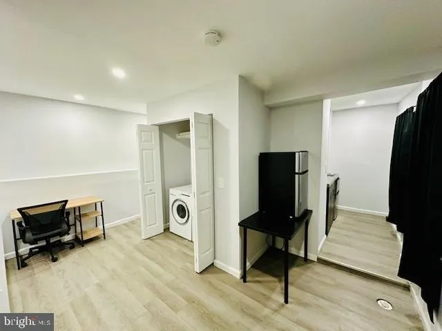 a view of a hallway with seating area