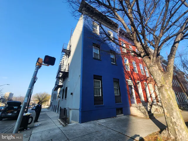 a view of a house with a tree