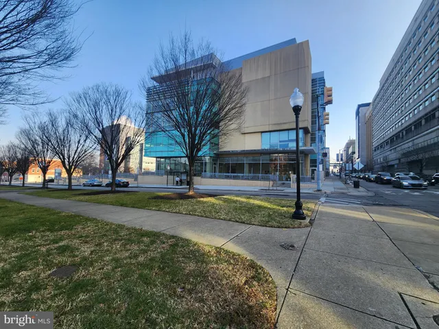 a kitchen with white cabinets and appliances