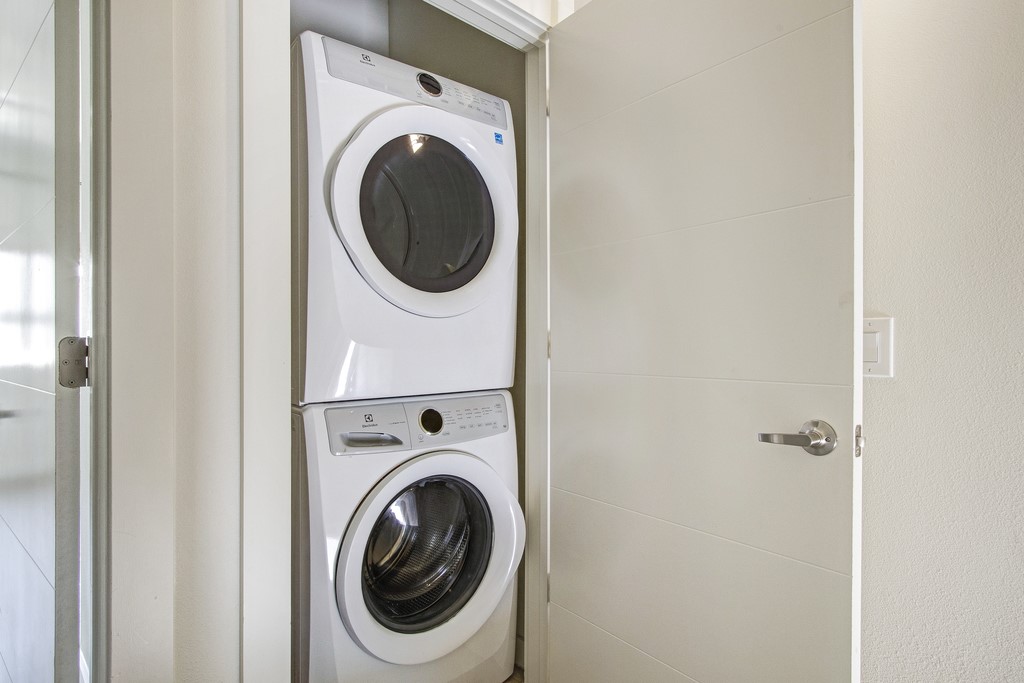 7805 Cooper Lane, Unit 602 Austin, TX 78745 - Photo 12 of 30 a utility room with dryer and washer