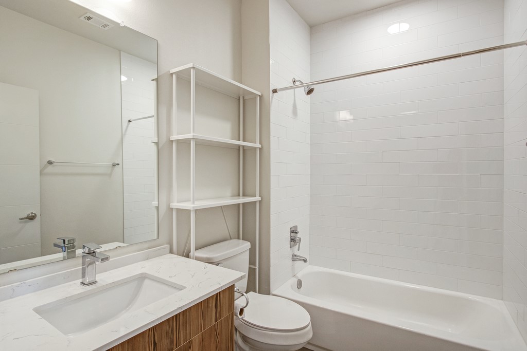 7805 Cooper Lane, Unit 602 Austin, TX 78745 - Photo 16 of 30 a bathroom with a sink toilet and shower