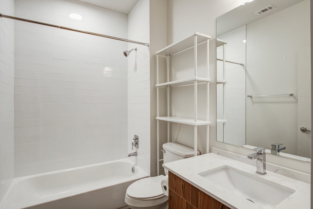 7805 Cooper Lane, Unit 602 Austin, TX 78745 - Photo 19 of 30 a bathroom with a sink toilet and shower