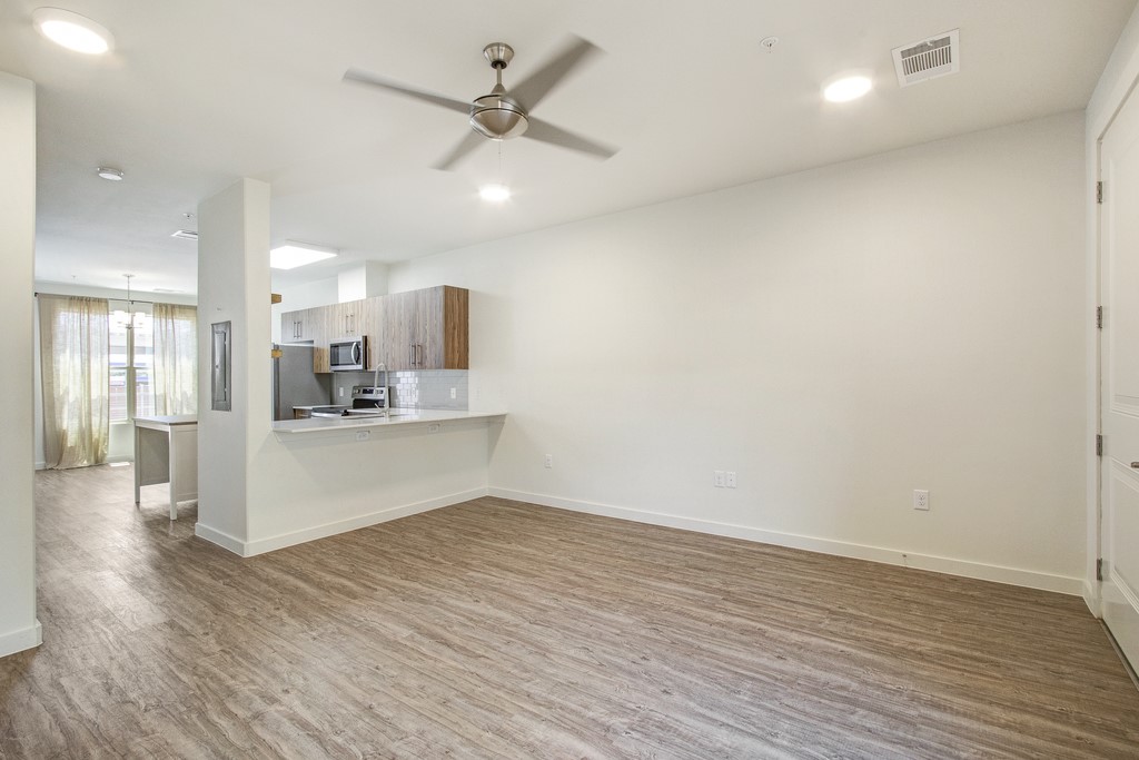 7805 Cooper Lane, Unit 602 Austin, TX 78745 - Photo 2 of 30 a view of kitchen with wooden floor and window