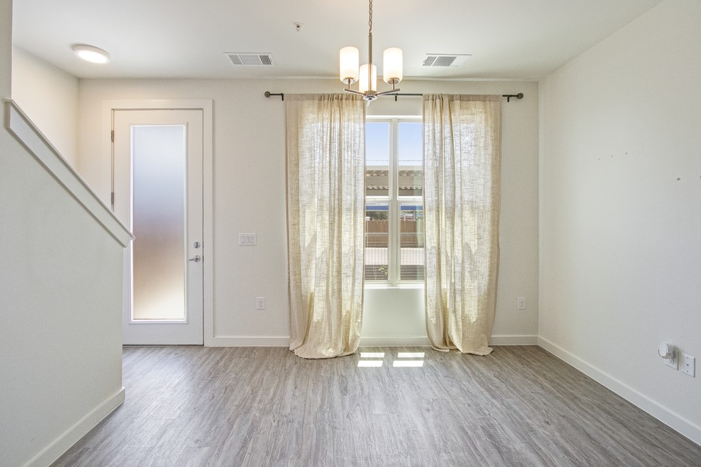 7805 Cooper Lane, Unit 602 Austin, TX 78745 - Photo 10 of 30 wooden floor in an empty room with a window