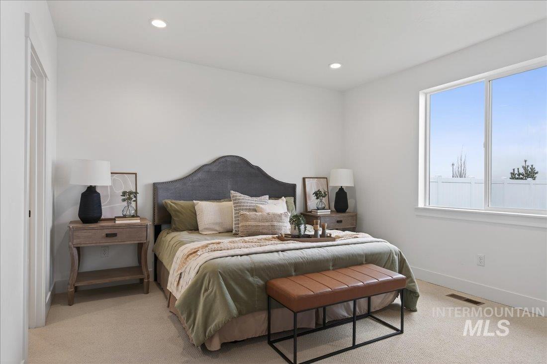 1268 West Swift Fox Street Meridian, ID 83642 - Photo 12 of 34 Bedroom with light colored carpet and recessed lighting