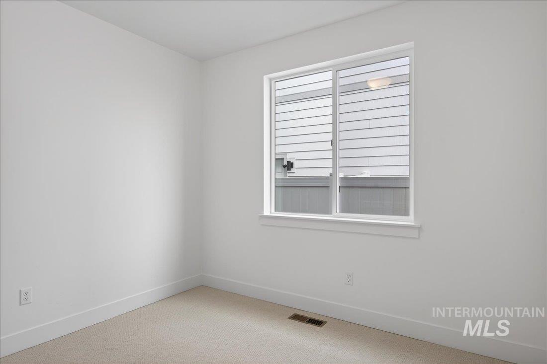 1268 West Swift Fox Street Meridian, ID 83642 - Photo 17 of 34 Carpeted empty room with baseboards