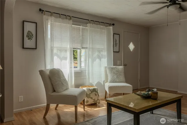 a living room with furniture and a window