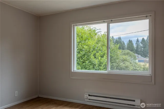a view of empty room with large window