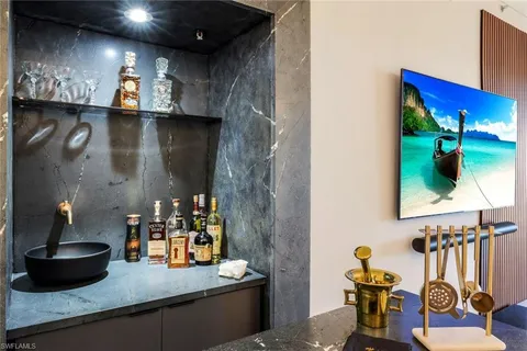 a kitchen with a refrigerator and sink