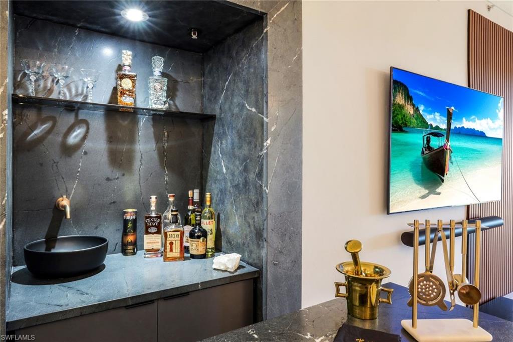 26871 Clarkston Drive, Unit 102 Bonita Springs, FL 34135 - Photo 11 of 50 a kitchen with a refrigerator and sink