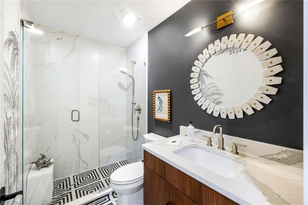 26871 Clarkston Drive, Unit 102 Bonita Springs, FL 34135 - Photo 16 of 50 a bathroom with a sink and a mirror