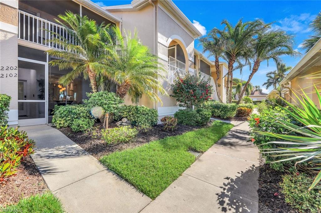 26871 Clarkston Drive, Unit 102 Bonita Springs, FL 34135 - Photo 25 of 50 a view of a pathway with a building