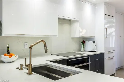 a kitchen with a sink and cabinets