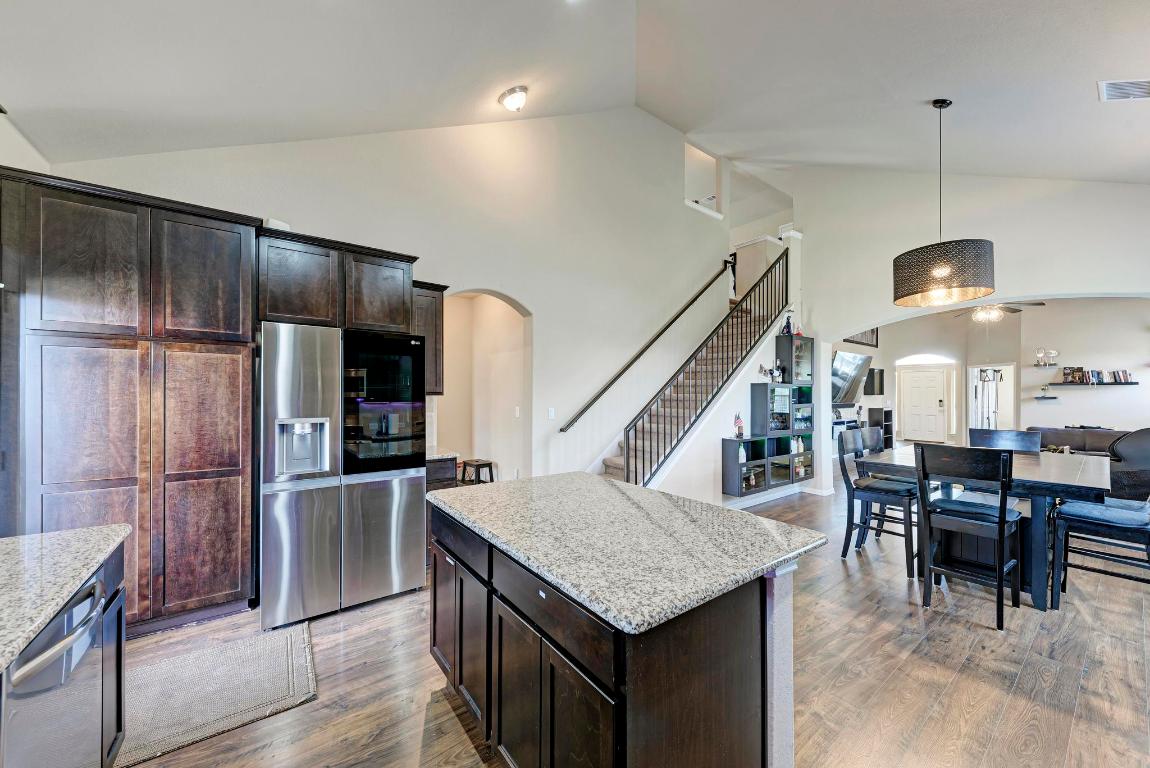 1023 Palo Duro Loop Round Rock, TX 78664 - Photo 12 of 33 Kitchen view of island, and cabinetry with fridge in the background. Convenient access to the stairs!