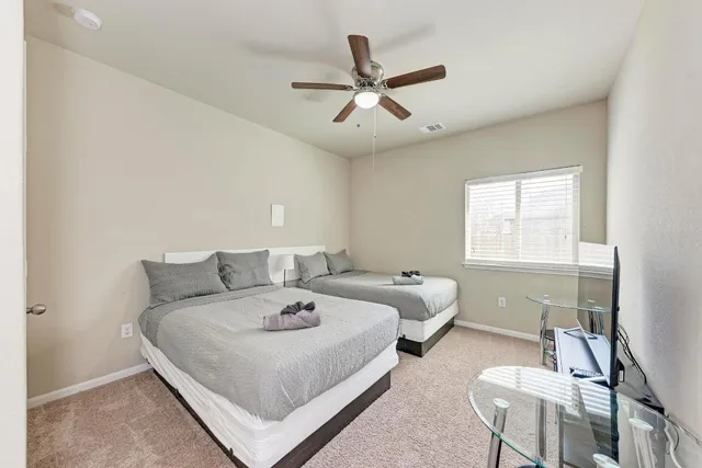 a bedroom with a bed and window