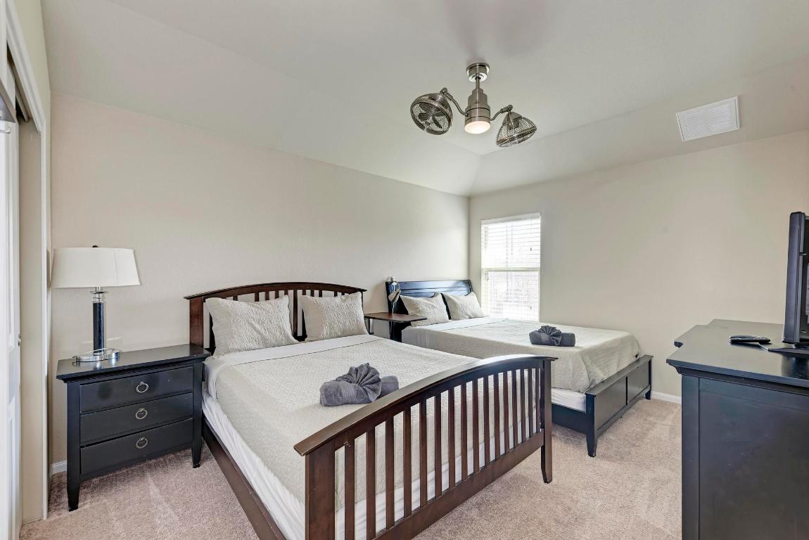 1023 Palo Duro Loop Round Rock, TX 78664 - Photo 26 of 33 Upstairs bedroom, set up with extra beds for use as an airbnb