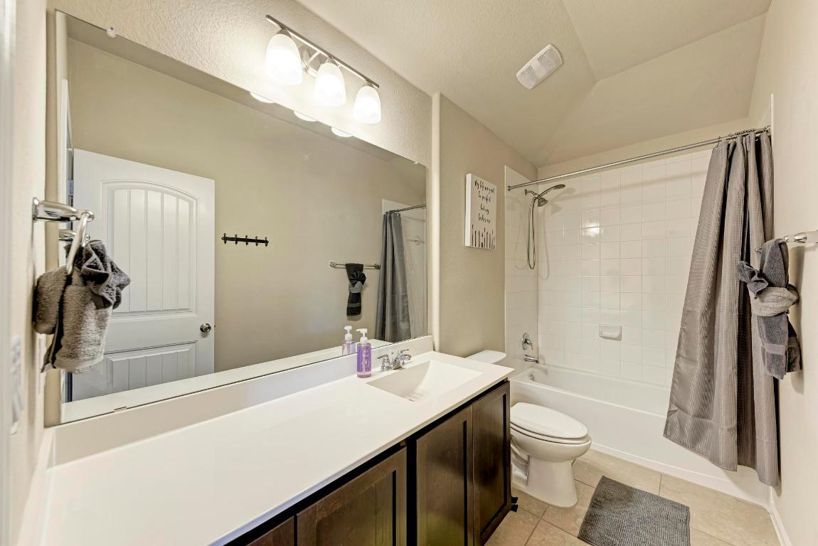 1023 Palo Duro Loop Round Rock, TX 78664 - Photo 27 of 33 Upstairs full bathroom, with single vanity and shower/tub combo