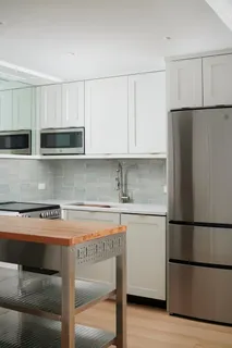 a kitchen with appliances cabinets and a counter top space