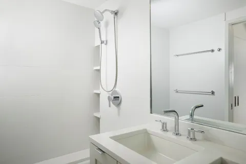 a bathroom with a sink and a mirror