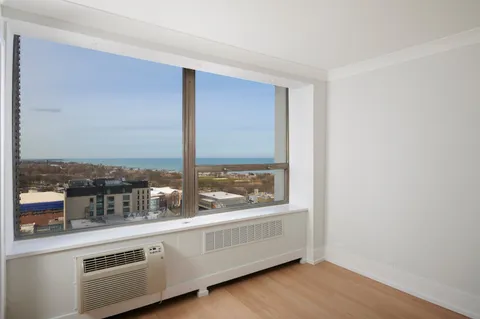 a view of a living room with a large window
