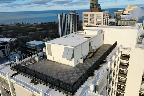 a balcony with table and chairs