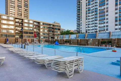 a view of a patio with a table and chairs