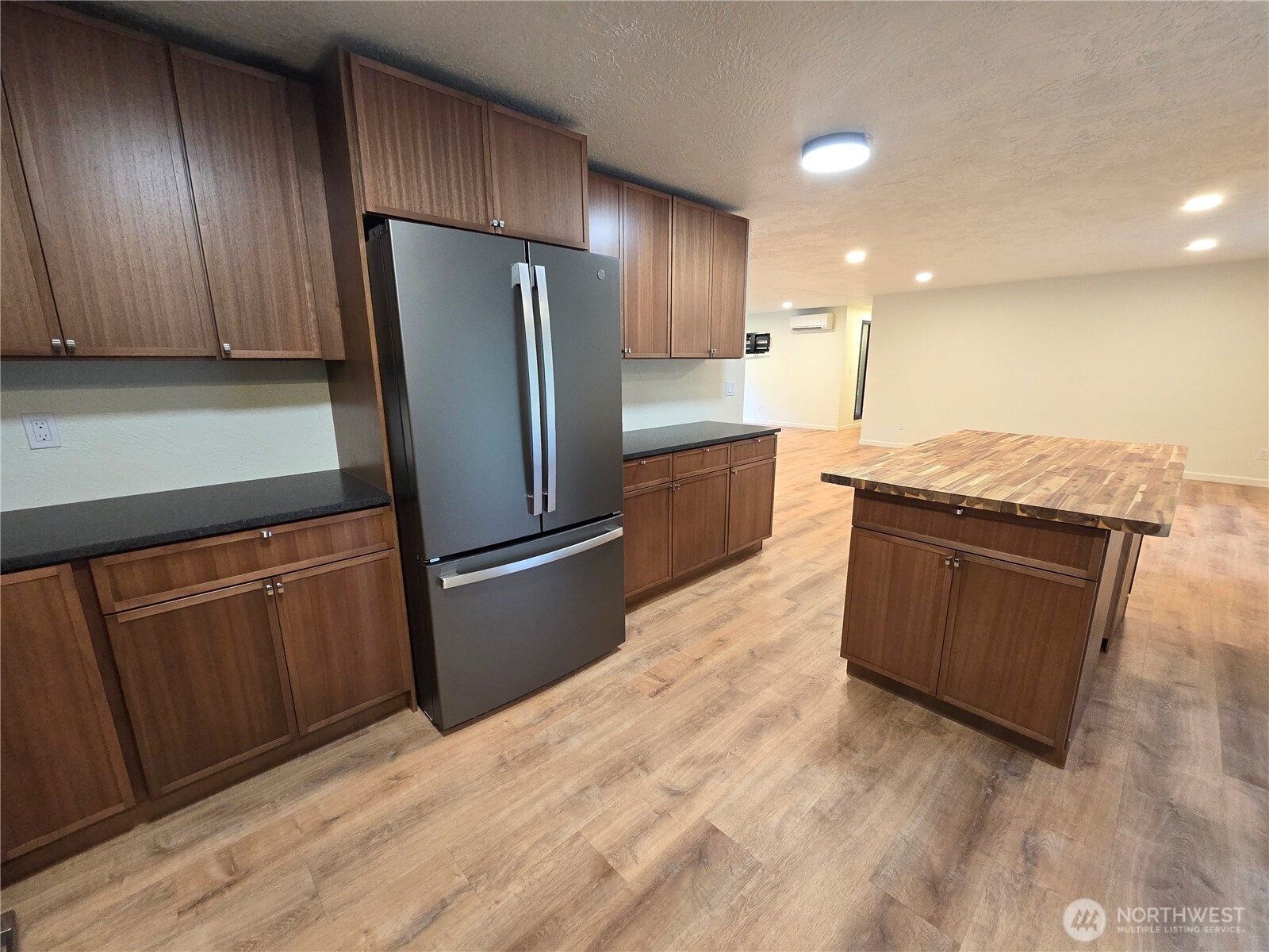 639 Lower Elwha Road Port Angeles, WA 98363 - Photo 15 of 38 a kitchen with stainless steel appliances granite countertop a refrigerator a sink and wooden cabinets