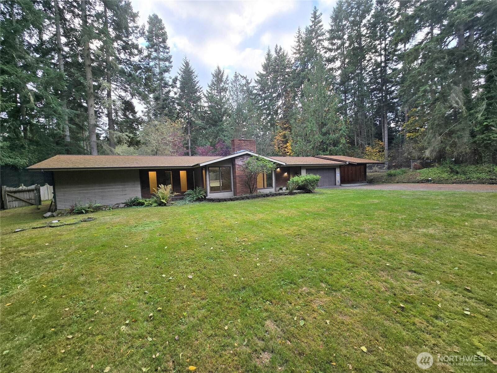 639 Lower Elwha Road Port Angeles, WA 98363 - Photo 3 of 38 a view of a house with a yard and sitting area