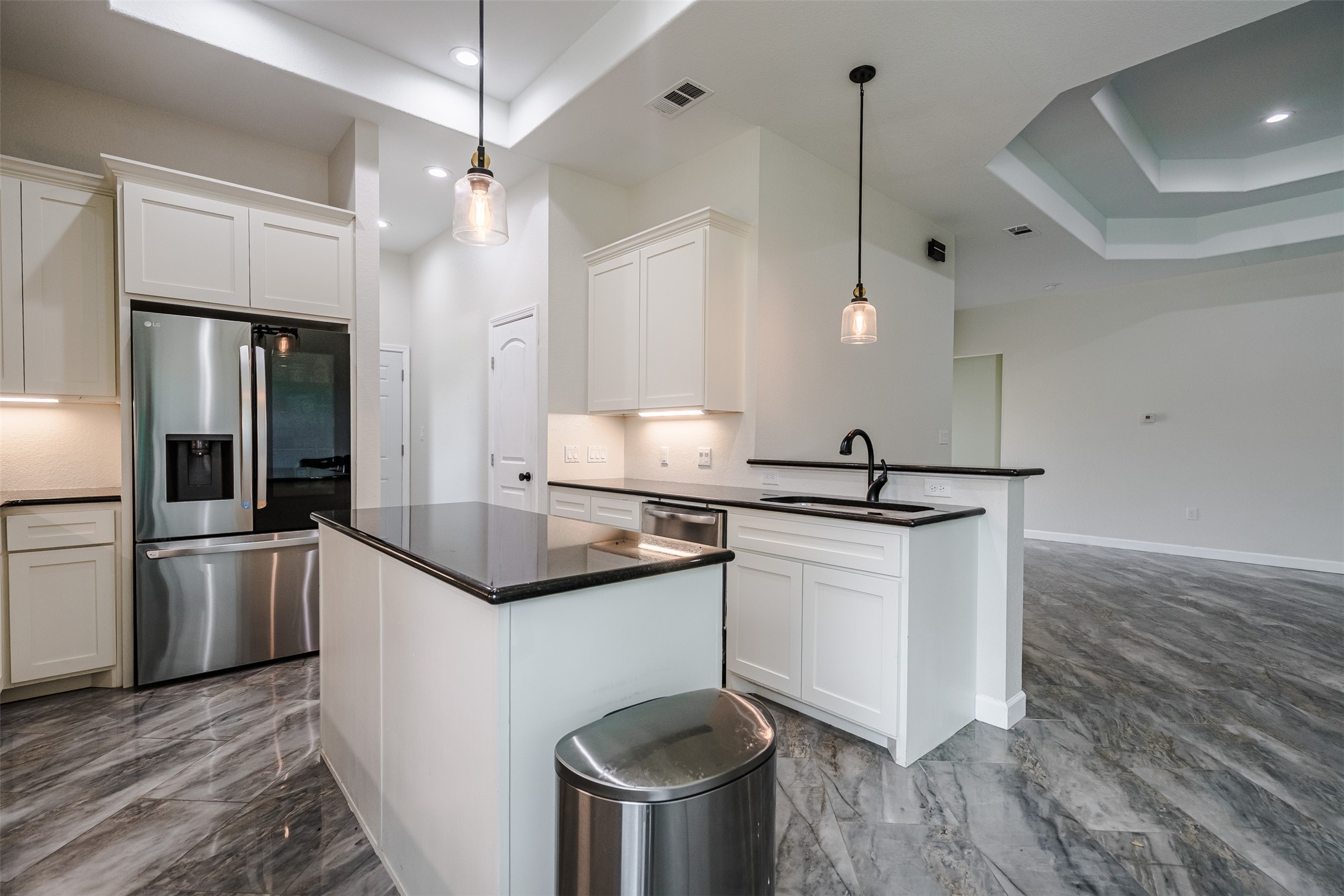 1354 Old Pin Oak Road Paige, TX 78659 - Photo 11 of 37 a kitchen with stainless steel appliances granite countertop a sink a stove and a refrigerator