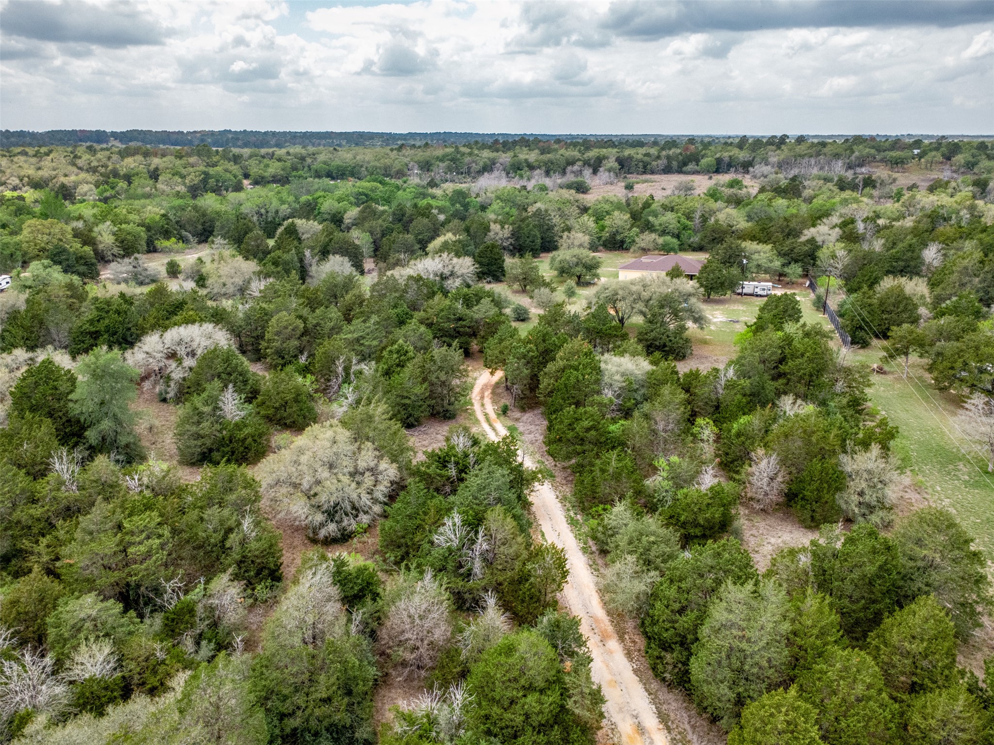 1354 Old Pin Oak Road Paige, TX 78659 - Photo 2 of 37 an aerial view of a houses with outdoor space and trees