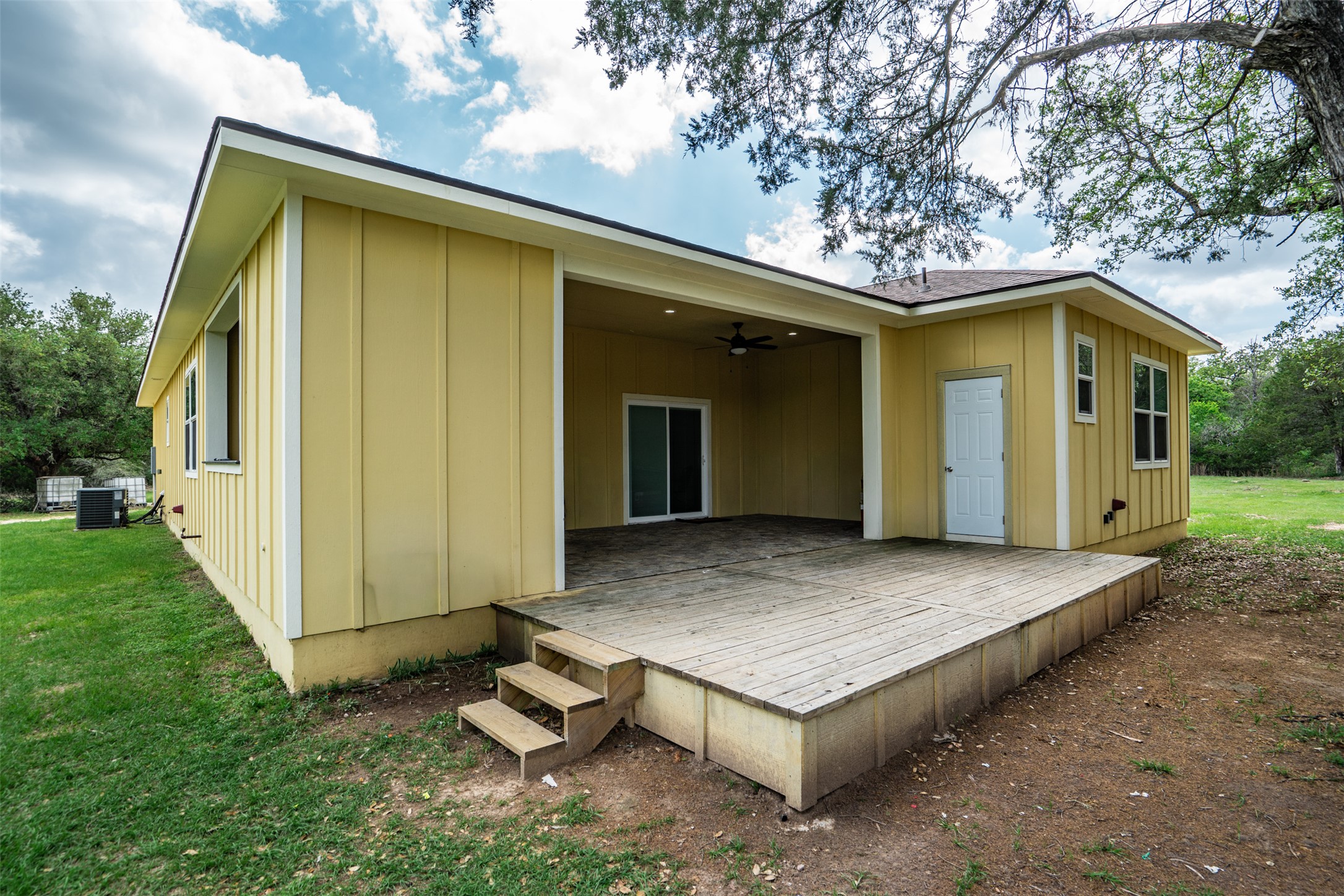 1354 Old Pin Oak Road Paige, TX 78659 - Photo 28 of 37 a view of a wooden house with a yard
