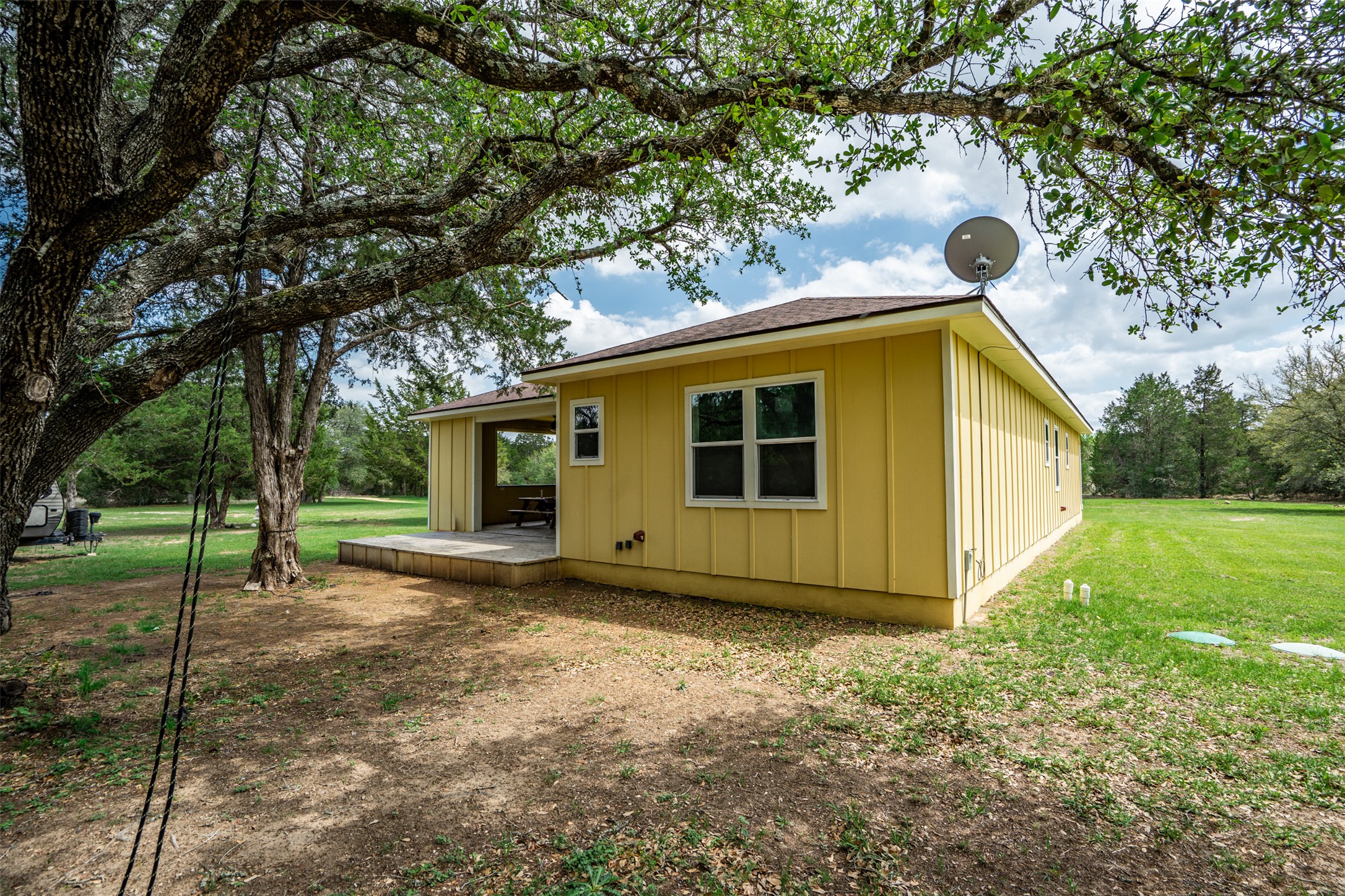 1354 Old Pin Oak Road Paige, TX 78659 - Photo 7 of 37 a view of a house with a backyard
