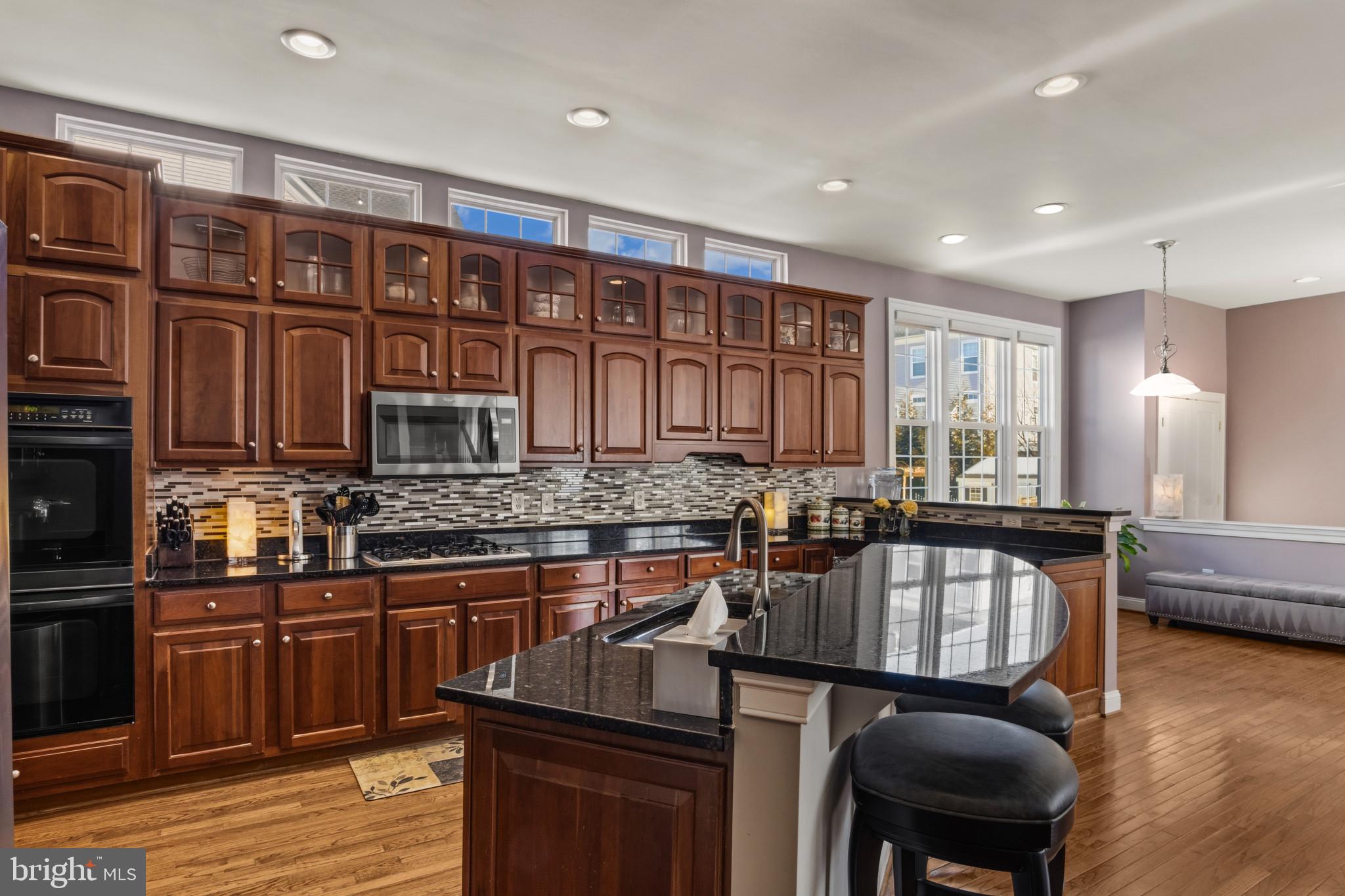 9223 Ox Road Lorton, VA 22079 - Photo 16 of 52 Open Kitchen with Gleaming Cabinets & Hardwoods