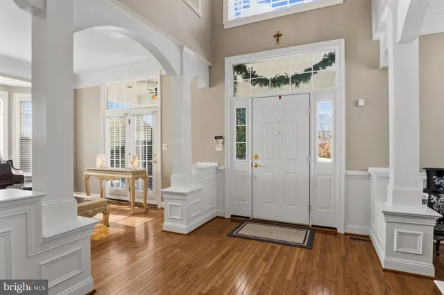 a living room with a fireplace furniture and a wooden floor