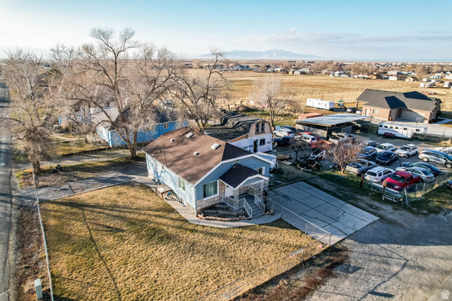 7609 Mountain View Road Lake Point, UT 84074 - Photo 5 of 16 Aerial perspective of suburban area featuring a mountainous background