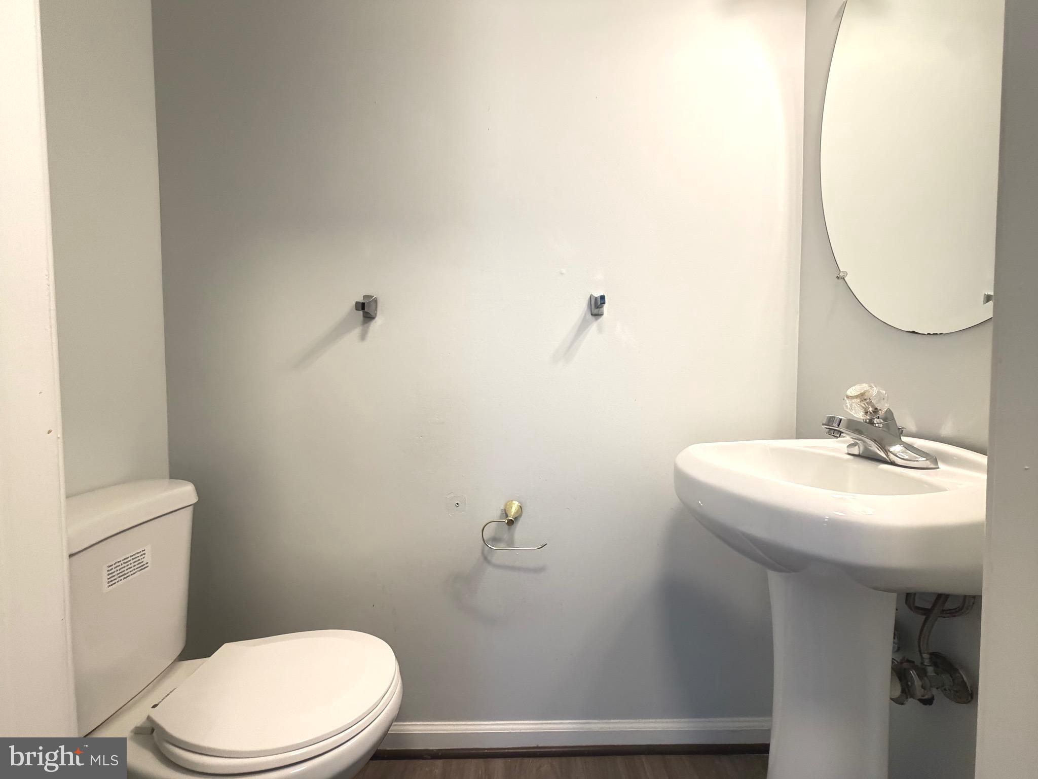 1905 Bulrush Court Odenton, MD 21113 - Photo 9 of 17 a bathroom with a sink mirror and toilet