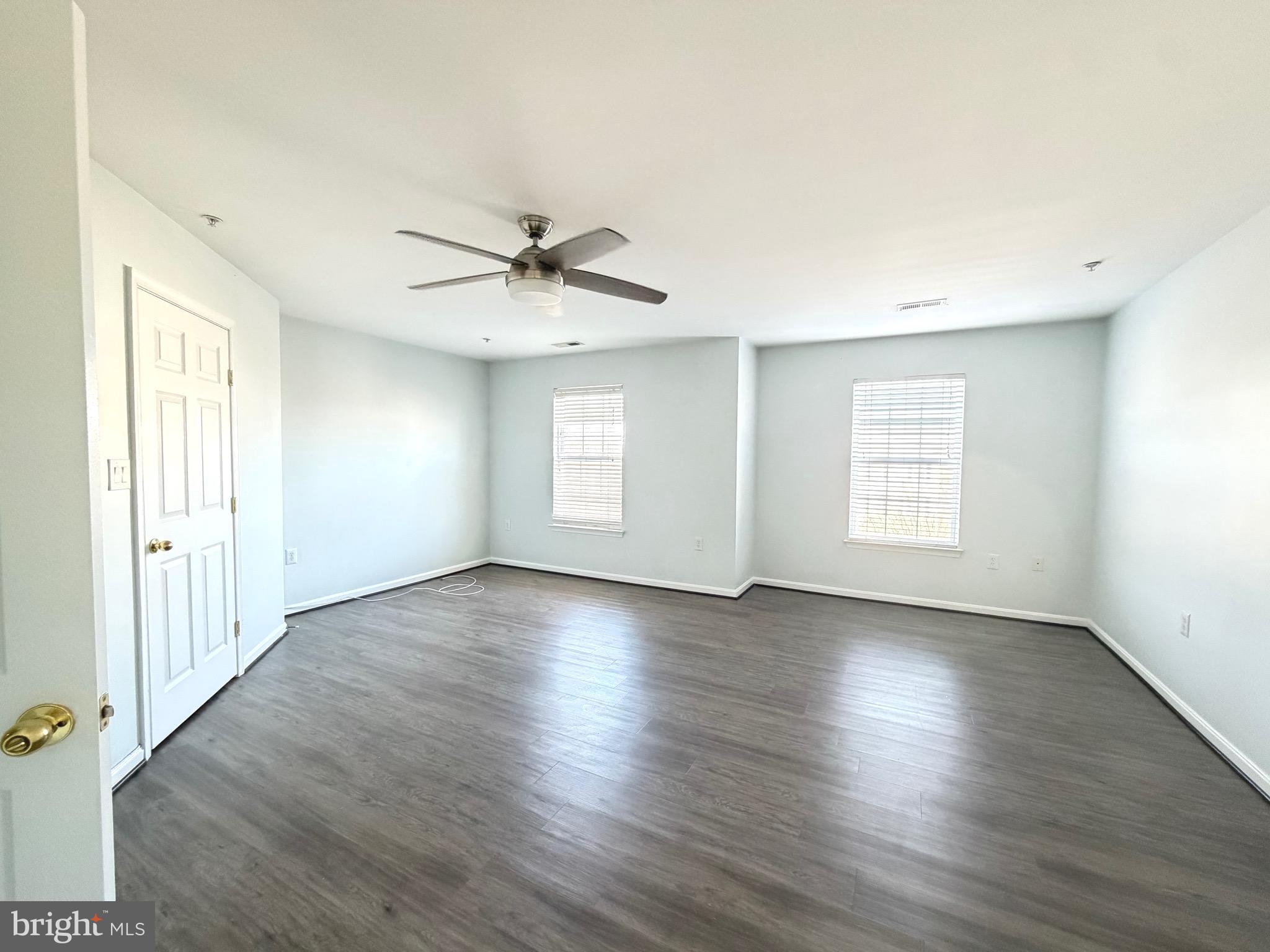 1905 Bulrush Court Odenton, MD 21113 - Photo 10 of 17 an empty room with wooden floor and windows