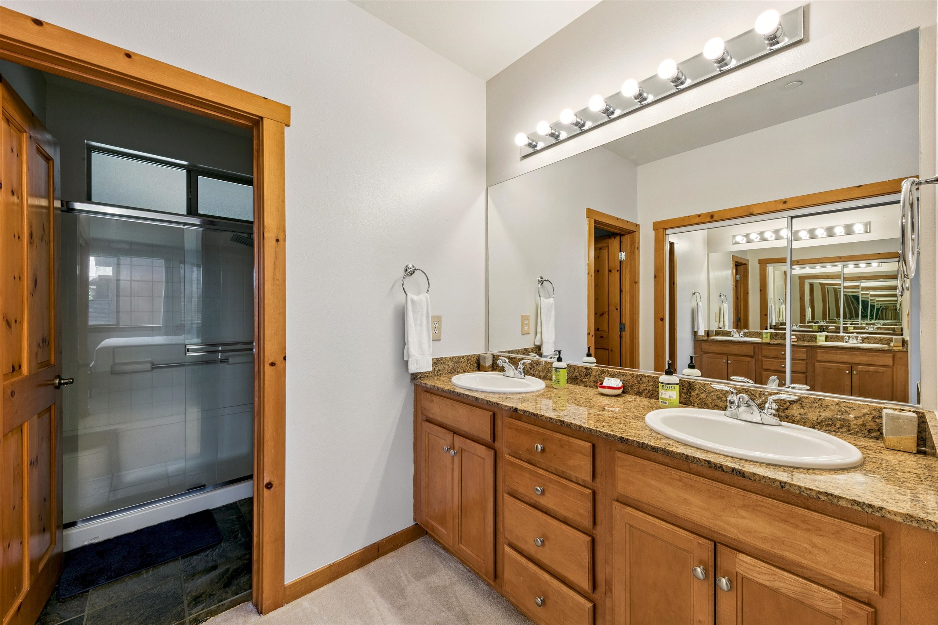 10592 Boulders Road, Unit 8 Truckee, CA 96161 - Photo 17 of 28 a bathroom with a granite countertop sink mirror and double