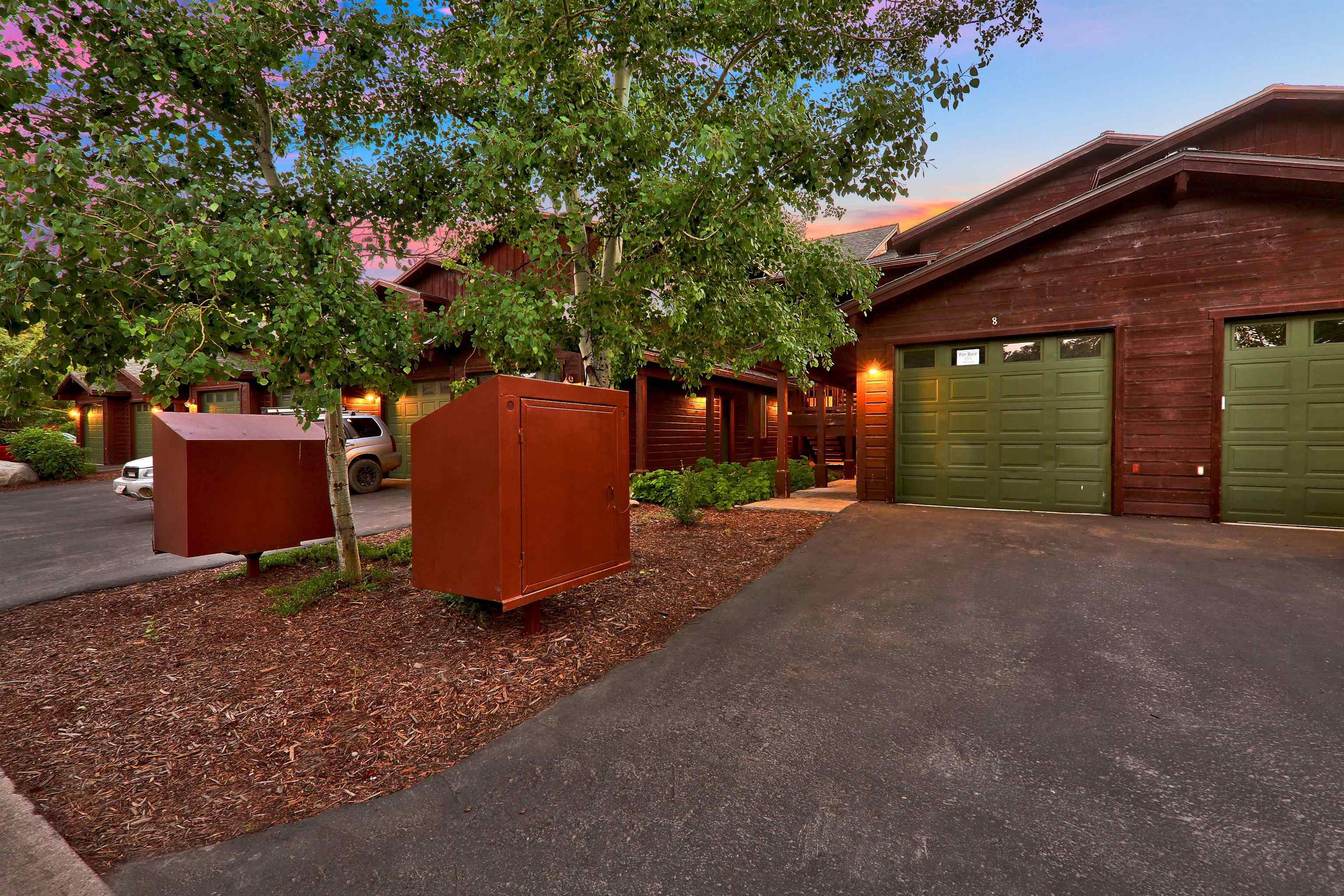 10592 Boulders Road, Unit 8 Truckee, CA 96161 - Photo 2 of 28 a backyard of a house with yard and garage