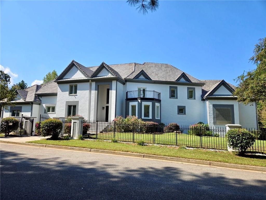 6509 Lily Trail Fairburn, GA 30213 - Photo 1 of 117 a front view of a house with a garden
